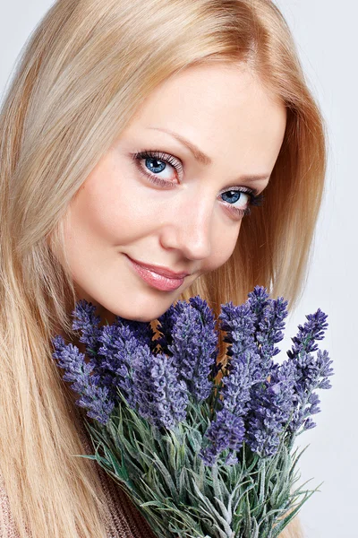 Cute blonde girl with a bouquet of lavender — Stock Photo, Image