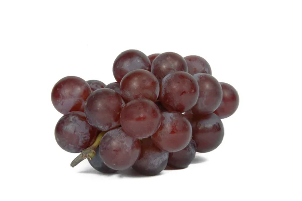 Семена красного винограда на белом фоне — стоковое фото