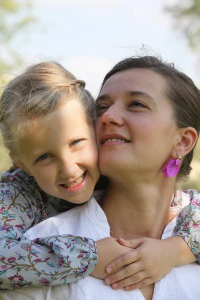 Daughter hugging her mother — Stock Photo, Image