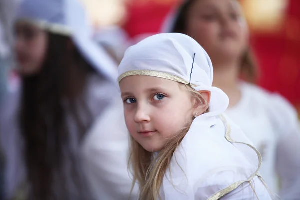 Girl in a white headdress — Stock Photo, Image