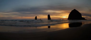 Sunset Over Haystack Rock on Cannon Beach clipart