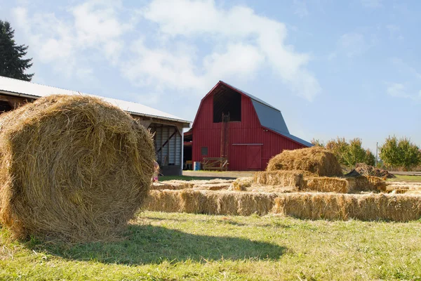 Roll of Hay by the Red Barn — Stock Photo, Image