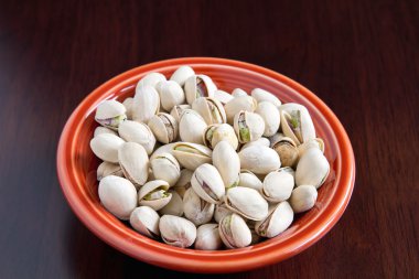 A bowl of Pistacios Nuts with Shell clipart
