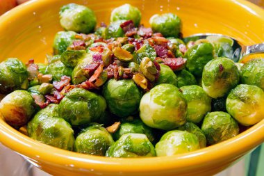 Thanksgiving Day Dinner Brussels Sprout with Bacon Bits and Pist clipart