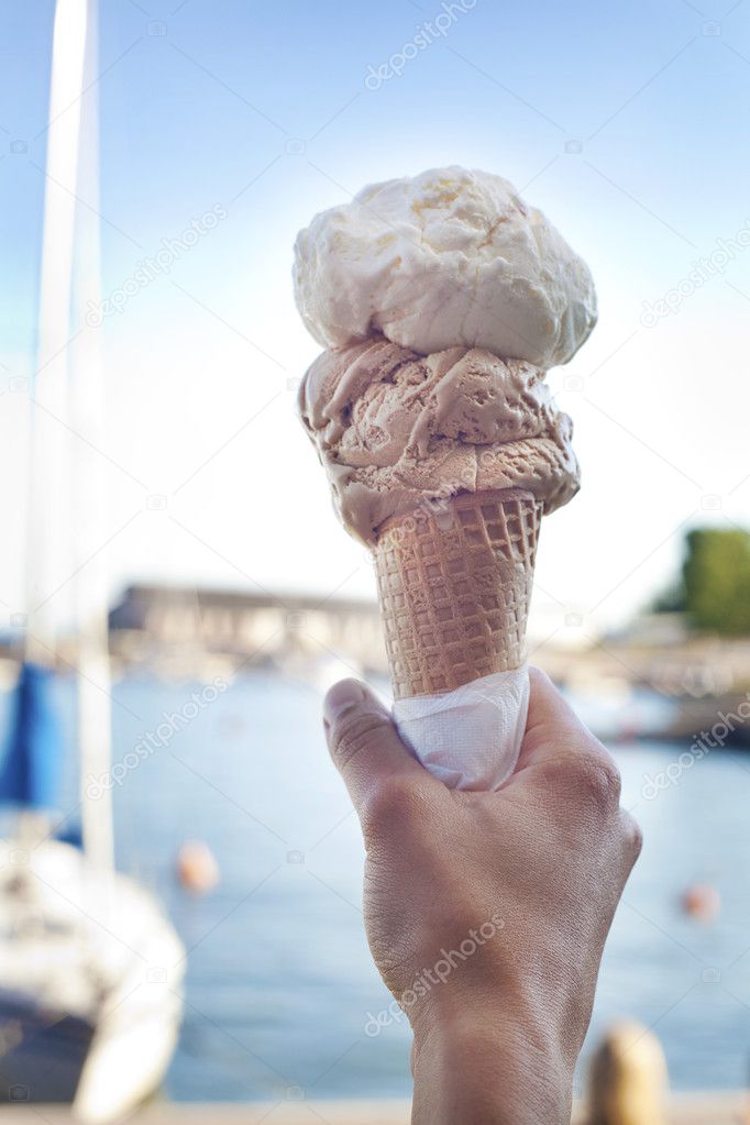 Ice in the sunshine - Hand holding an ice-cream cone