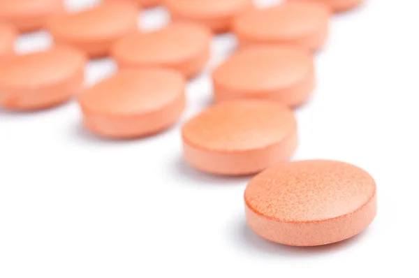 stock image Follow leader - orange pills close-up