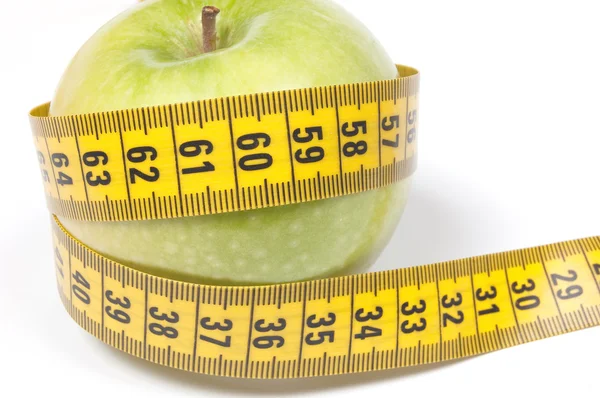 Green Apple with measuring tape, isolated on white — Stock Photo, Image