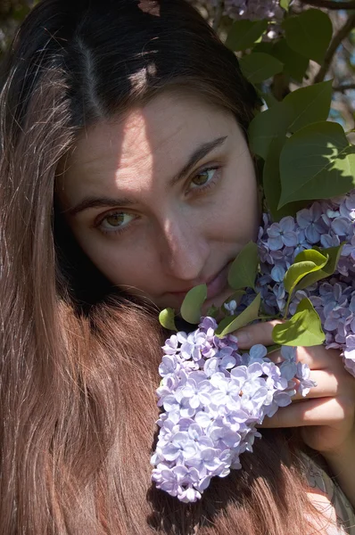 stock image Woman with lilac flowers