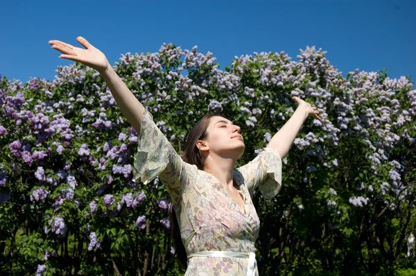 stock image Woman over blossom lilac