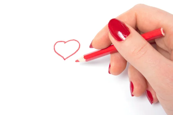 Žena nakreslete symbol červené srdce — Stock fotografie