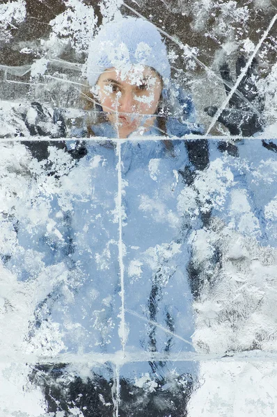 stock image girl behind ice wall