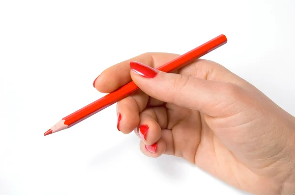 Czerwony ołówek w ręku — Zdjęcie stockowe