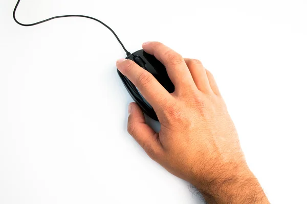 Mouse de computador preto com mão sobre mesa branca — Fotografia de Stock