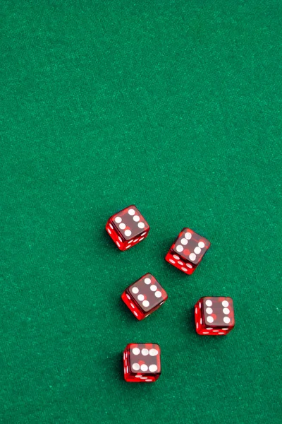Five dice in the corner on green gaming table — Stock Photo, Image