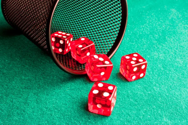 Five red dice near a container — Stock Photo, Image