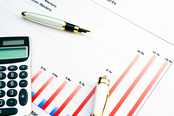 Calculator on a financial chart — Stockfoto