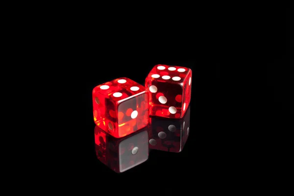 A pair of dice on the black reflecting table — Stock Photo, Image