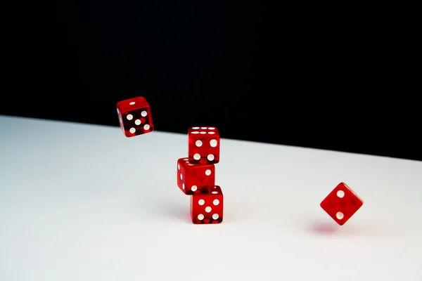 Detail of five red dice on black and white background in movement — Stock Photo, Image