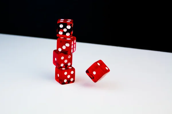 Detail of Piles of five red dice on white background — Stock Photo, Image