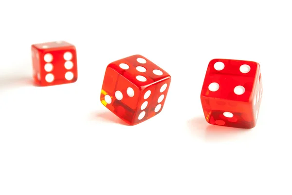 Close Up of two red dice and one unfocused — Stock Photo, Image