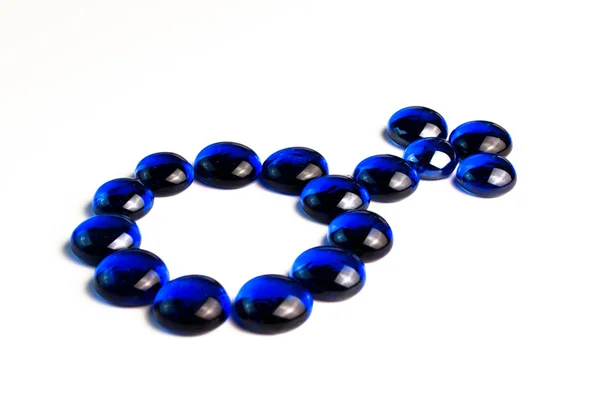 Symbole masculin dessiné avec des pierres bleues — Photo