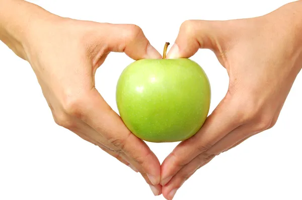 Heart shaped hands holding an apple — Stock Photo, Image