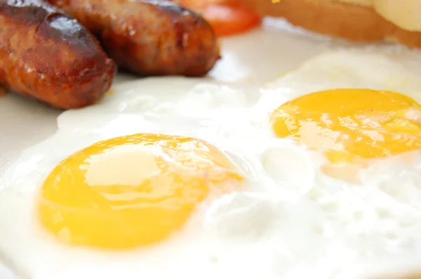 Tasty sausages and eggs — Stock Photo, Image