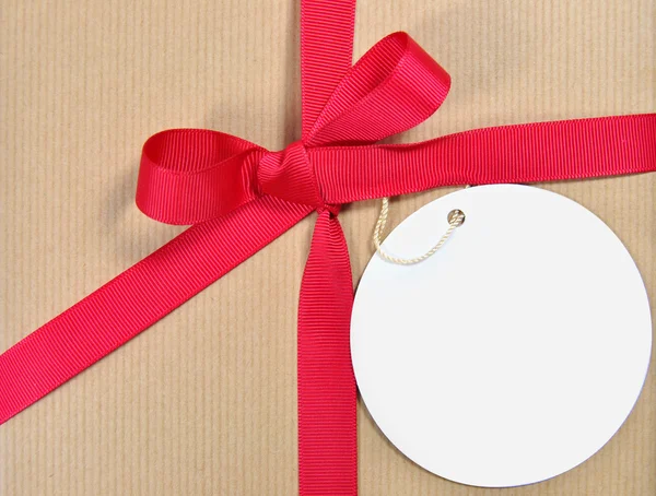 Gift with tag — Stock Photo, Image