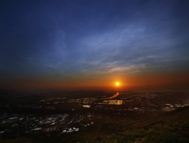 Dramatic sunset in the new city of Hong Kong clipart