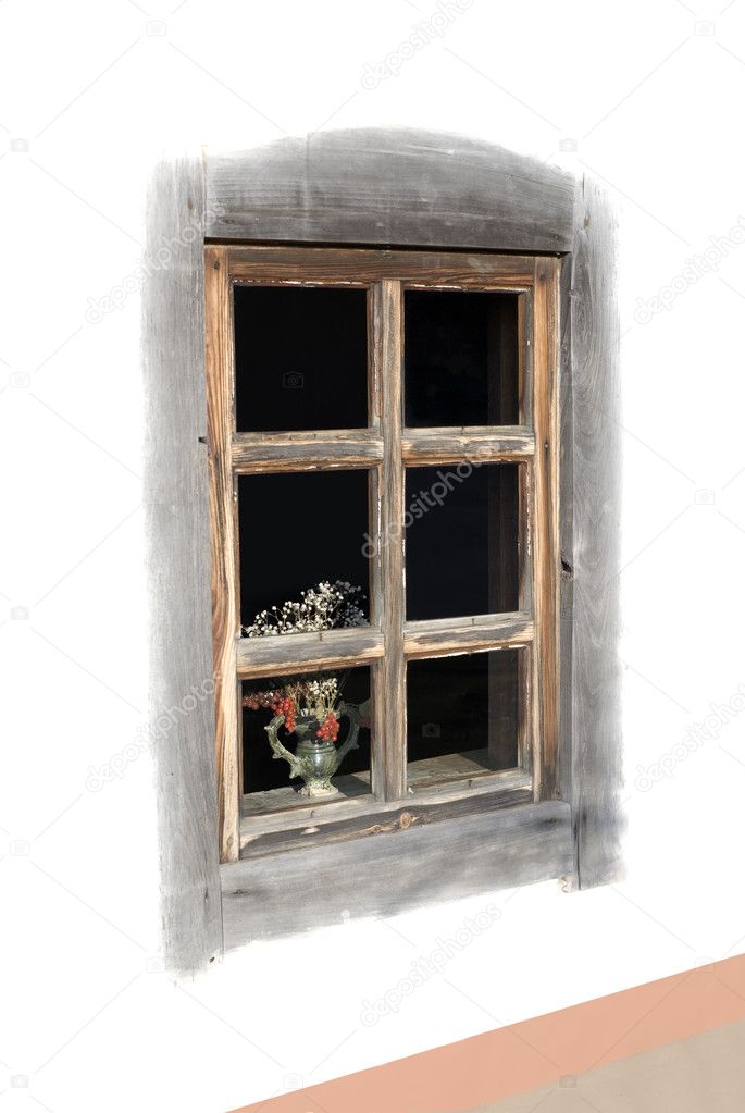 Window of old hut with a bouquet