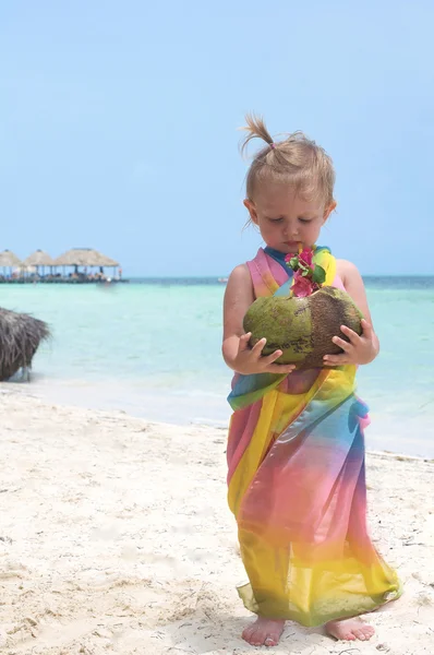 A baby girl and coconut — Stock Photo, Image