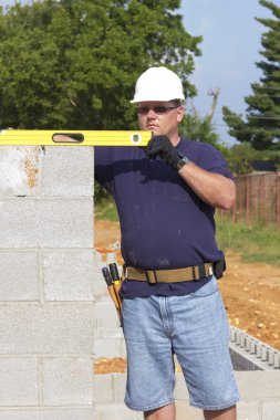 Mason with Concrete Block clipart