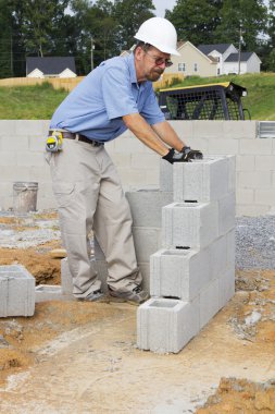 Mason with Concrete Block clipart