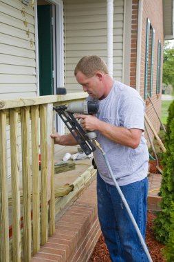 Carpenter building porch rail clipart