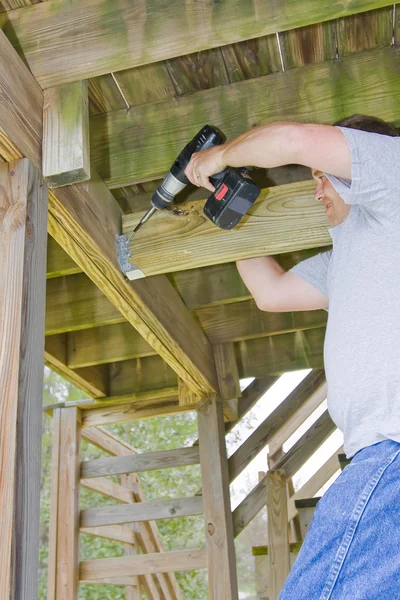 Carpenter securing deck — Stock Photo, Image
