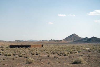 Caravanserai ruins in iran desert clipart