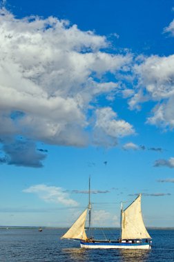 Traditional sailboat on the sea clipart