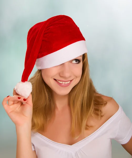 Beautiful happy girl in a Christmas hat — Stock Photo, Image