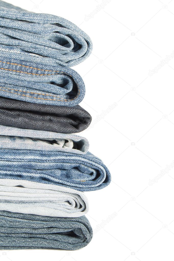 A pile of jeans on a white background
