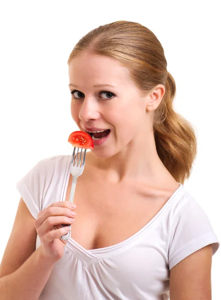 Dziewczyna zjada pomidor — Zdjęcie stockowe