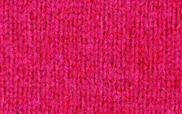 Stricken wollene rosa Textur — Stockfoto