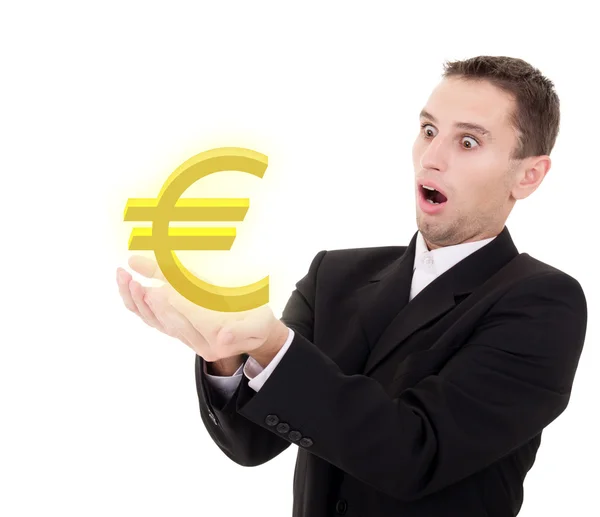 Businessman chooses golden euro sign — Stock Photo, Image