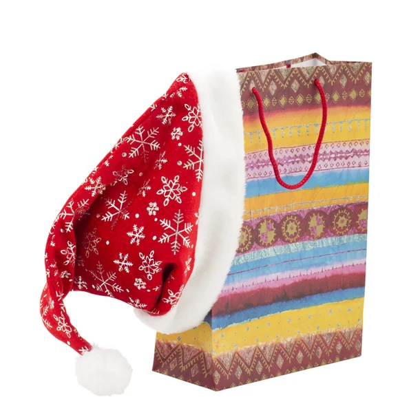 Bolsa de regalo y un sombrero de Navidad —  Fotos de Stock