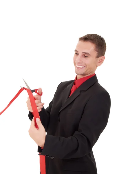 Бізнесмен вирізає червону стрічку — стокове фото