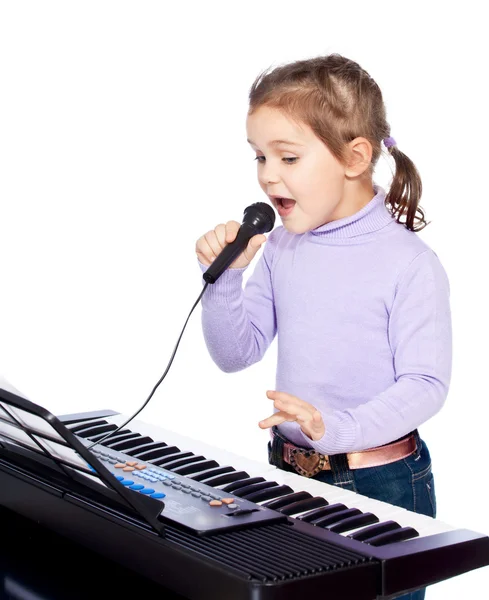 Girl playing the piano — Stock Photo, Image