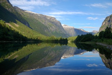 Fjord in the middle of green mountains clipart