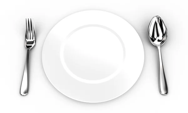Fourchette et cuillère près d'une assiette — Photo