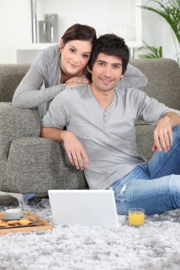 Portrait of a young couple at home clipart