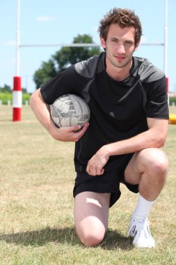 Portrait of a rugby player clipart