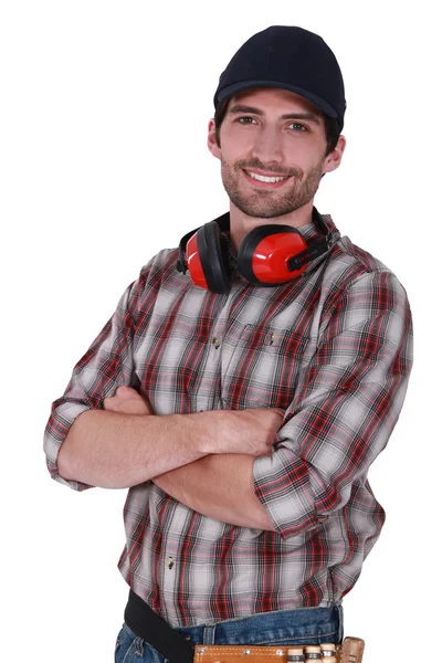 A munkás, a nyaka körül fülvédő portréja — Stock Fotó